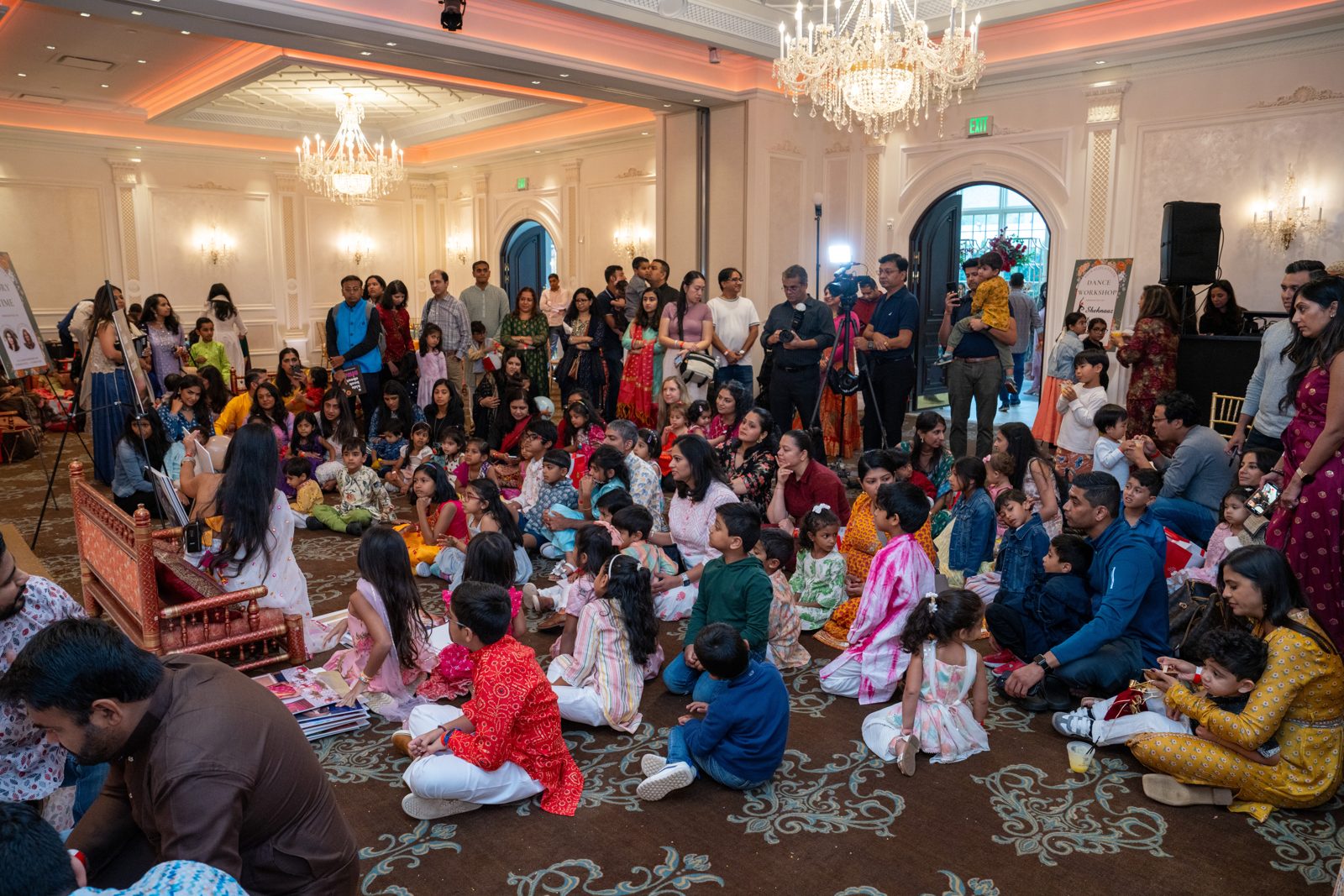 A packed room of families at Diwali Play Date 2024